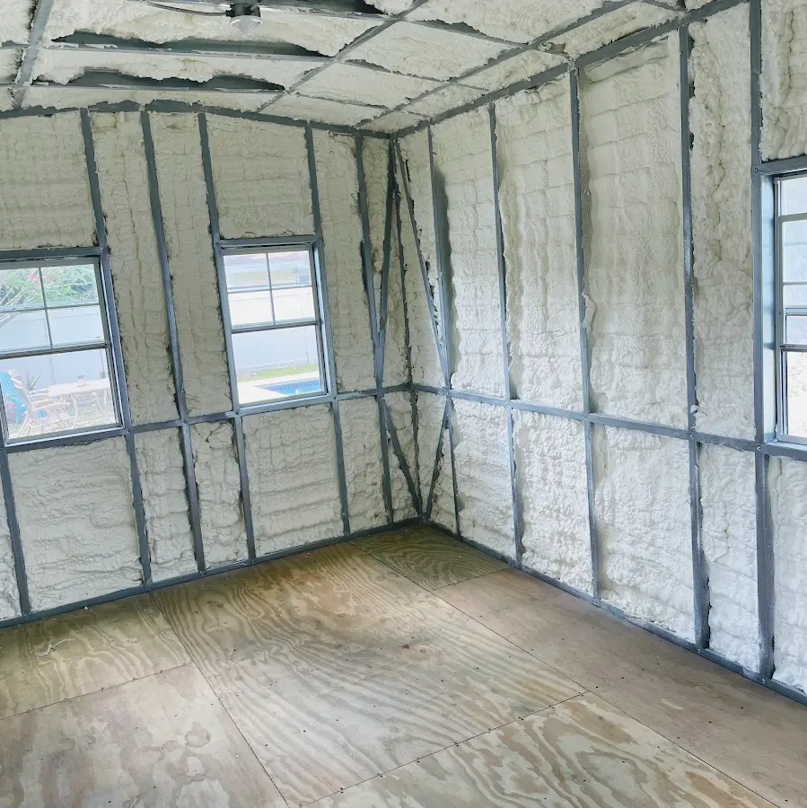 Closed-cell spray foam insulation applied to wall cavities in a residential project in Fraser